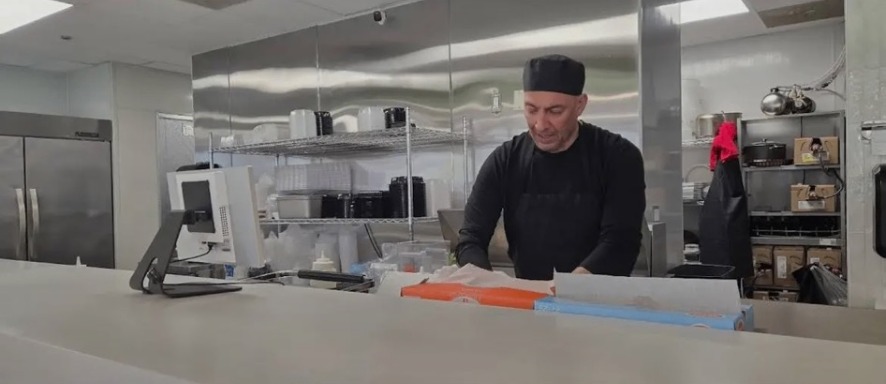 Shawarma Shop owner preparing food in the kitchen